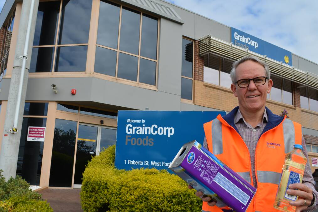 GrainCorp Oils group general manager, Sam Tainsh, with some of the canola oil products refined and packed at the company's newly upgraded Melbourne plant.