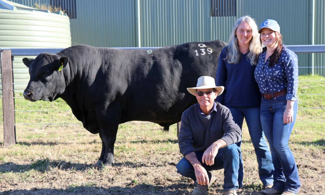 The $42,000 sale-topper Sugarloaf Timeless Q139 with Jim, Sally and Becky Tickle, Sugarloaf Angus, Dungog. Photo: supplied 
