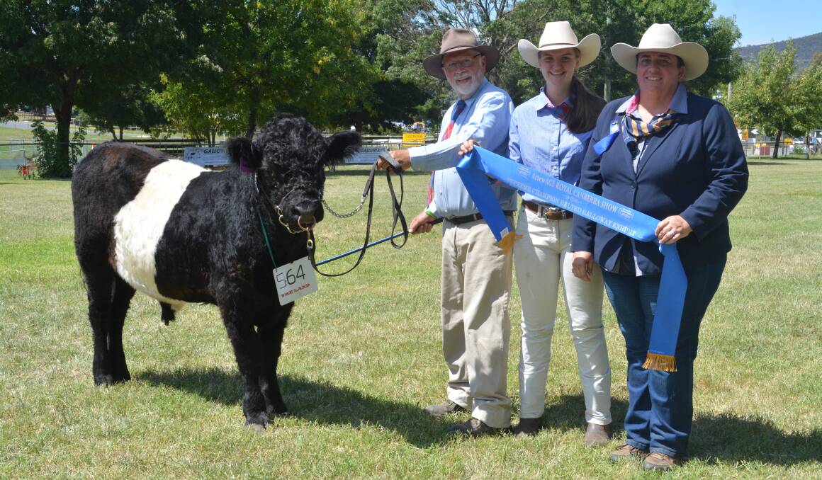 SUPREME: Benvuie Leith held by owner Gregory Stuart, Benvuie stud, Yass, with Caelan Read, Southern Highlands, and judge Renae Keith, Allenae Angus and Poll Herefords, Roslyn.
