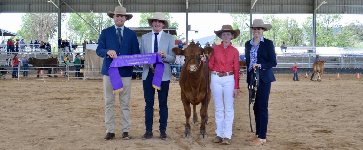 Judges Murk and Kate (right) Schoen of Aarden Angus and Schoen Pastoral, Corowa, and Sam Parish of Kevin Miller, Whitty, Lennon and Co and Mass Genetics, Forbes, with overall grand champion parader Sarah Randle, St Joseph's High School, Aberdeen. 