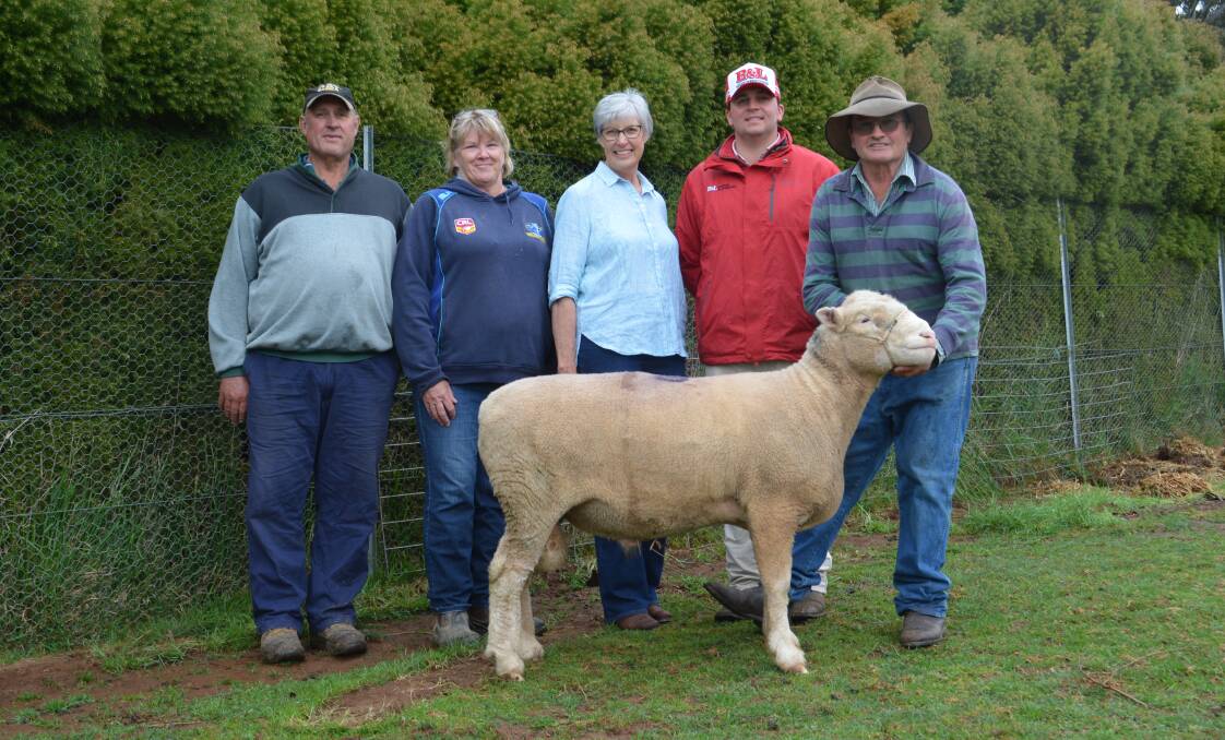 The $2600 top-priced ram with buyers Geoffrey and Cheryl Gilbert, The Grove, Trunkey Creek, vendor Christine and Greg (right) Healey of Mt Bathurst Poll Dorsets, Black Springs, and agent Tom Card of selling agents Bowyer and Livermore, Bathurst. 