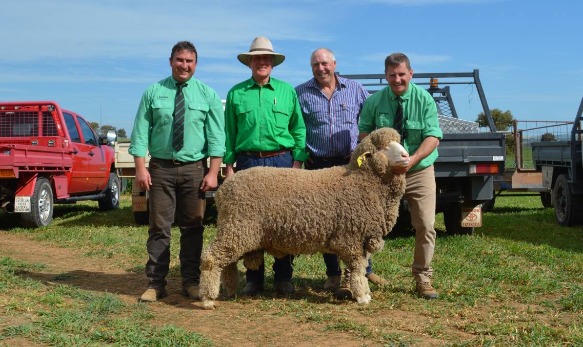 Auctioneers Tim Woodham and Rick Power (right) from Nutrien, with Brundanella studmaster Ian Griffith, Grenfell, and buyer of the $10,000 top-priced ram Adrian O'Keeffe of Bungoona Merinos, Molong. Photo: Hannah Powe 