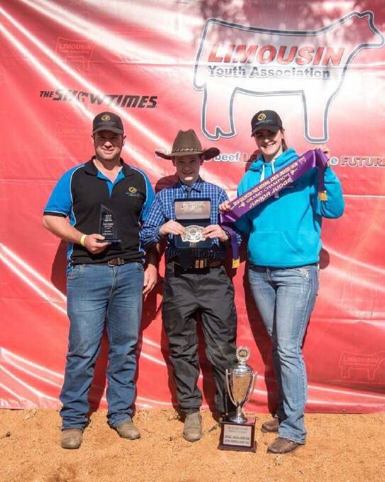 Craig and Tamara Corby, Goldstein Park Limousins, presented Jack Whitty (centre) from JR Limousins, Forbes, with the grand champion junior judge trophy at the Coonabarabran event. Photo by Emily H Photography. 
