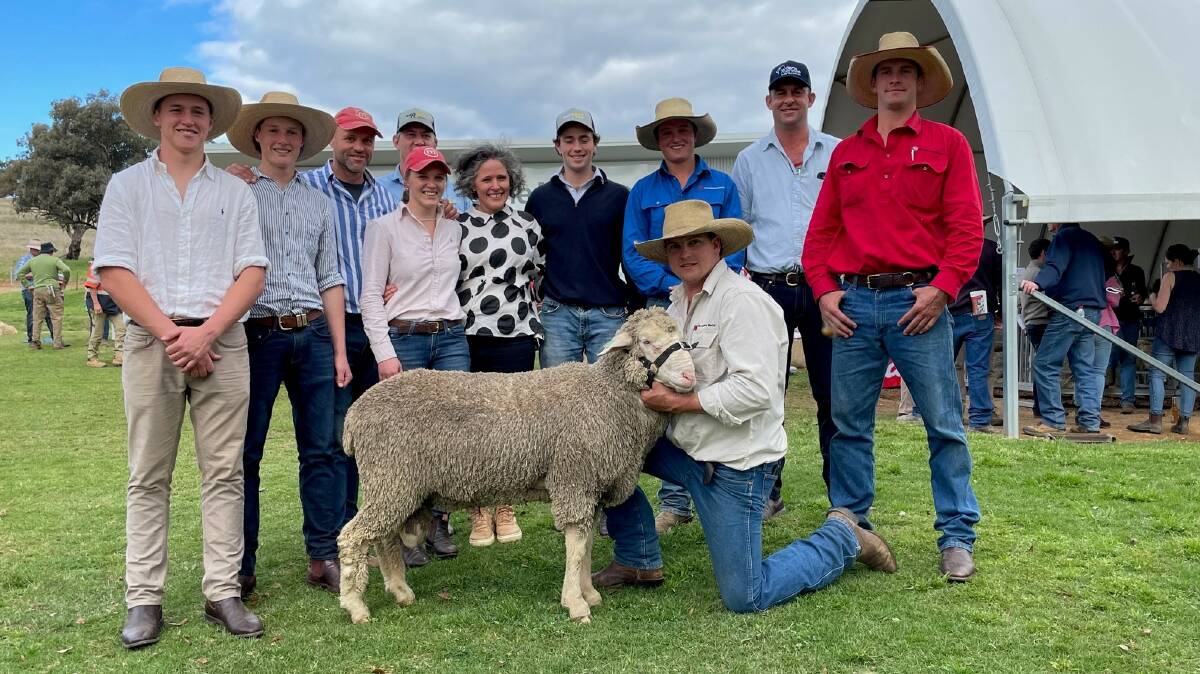 MUMBLEBONE MERINOS: The $24,000 top-priced ram with vendor, Chad Taylor (third left), and buyer, Simon Coutts (second right) for his Willera stud, Serpentine, Vic. Photo: Mark Griggs 