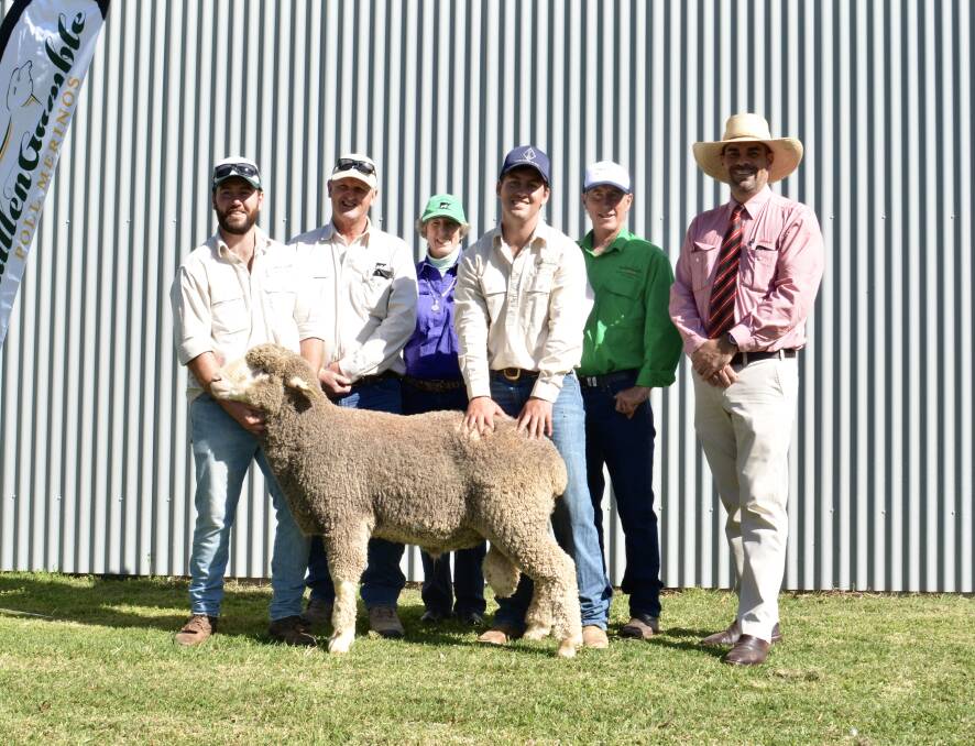 The $4600 top ram with Max Edwards, Ian and Brenda McColl, Rocky Glen Ag, Barraba, Hugh and Stewart Edwards, GullenGamble, and auctioneer Martin Simmons, Elders Dubbo. 