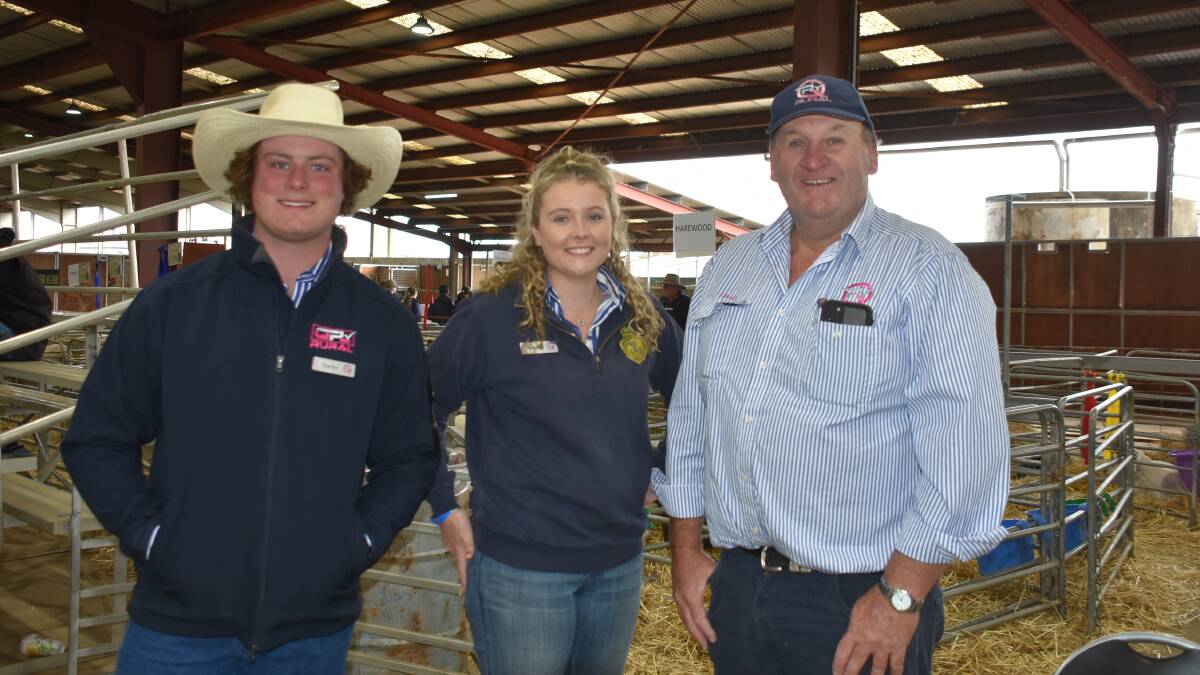 QPL trainee livestock and station agent Charles Hogan, livestock agronomist Emma Finemore and principal Craig Pellow at the recent NSW State Sheep Show. 