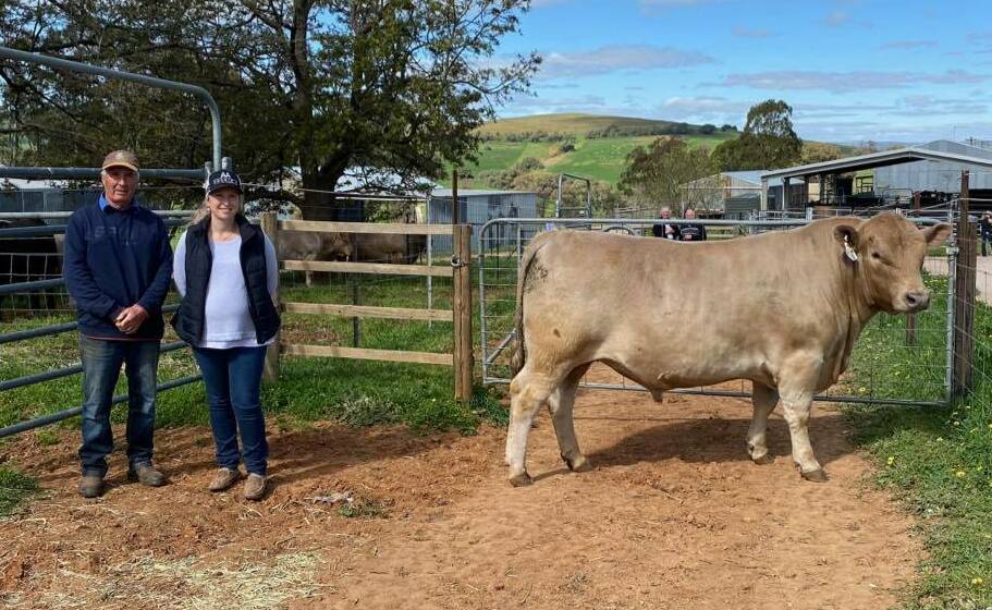 Ian Wilcox of Ayr Park, Woodstock, with Annika Whale of Double A Cattle Company, Cowra, and the $10,500 sale-topper, Ayr Park Quincey Q11. Photo: Sue Powe 