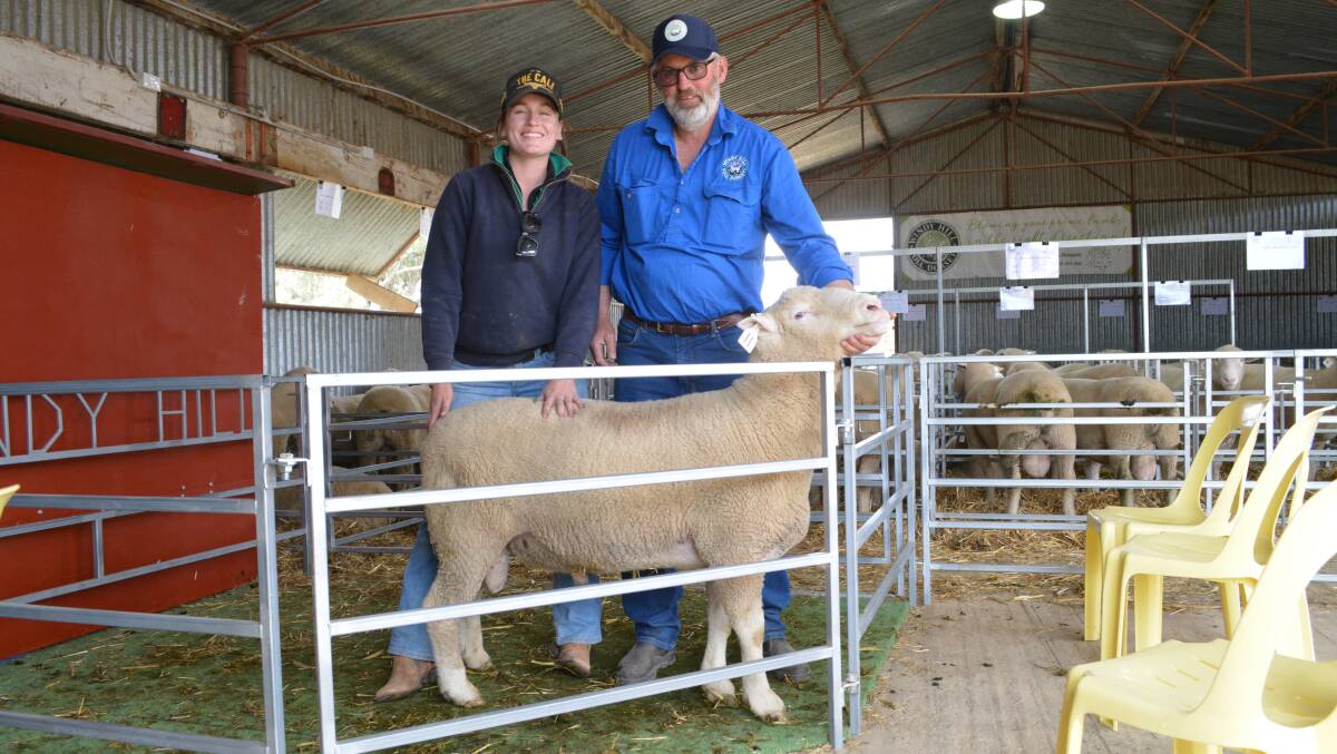 The Freeman family's equal top-priced ram with their worker Jo Notting, Neville, and vendor Chris Roweth of Windy Hill Poll Dorsets, Browns Creek. 