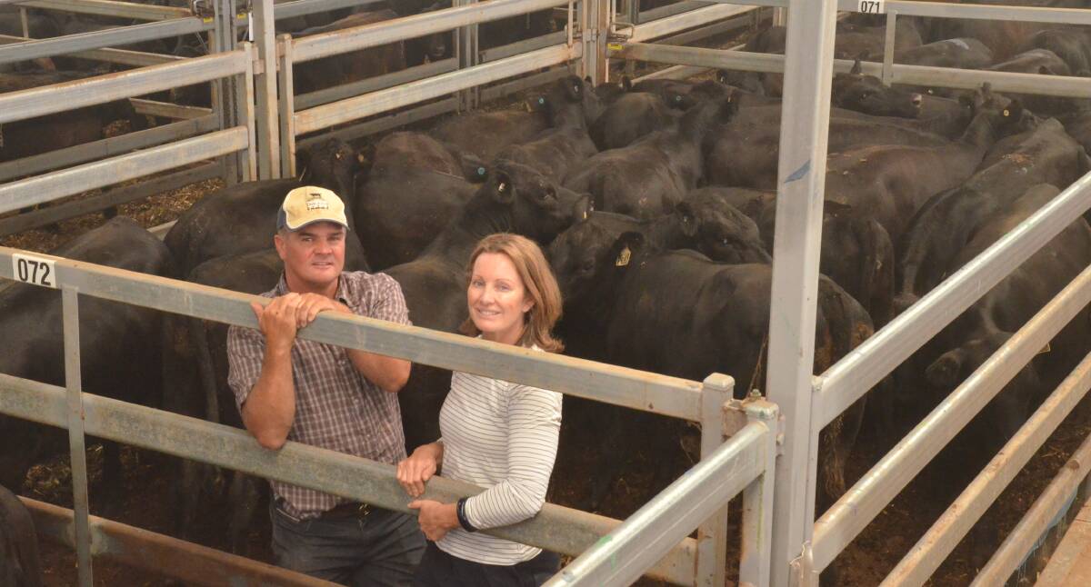 Tim and Jessica Scott of Table Top Angus, Table Top, with their 20 homebred heifers weighing an average 429kg and selling at $1180 each. The couple have been running the Table Top stud and commercial enterprise for 20 years and currently run 1000 cows, half in the stud and half being commercials. Photo: Mark Griggs
