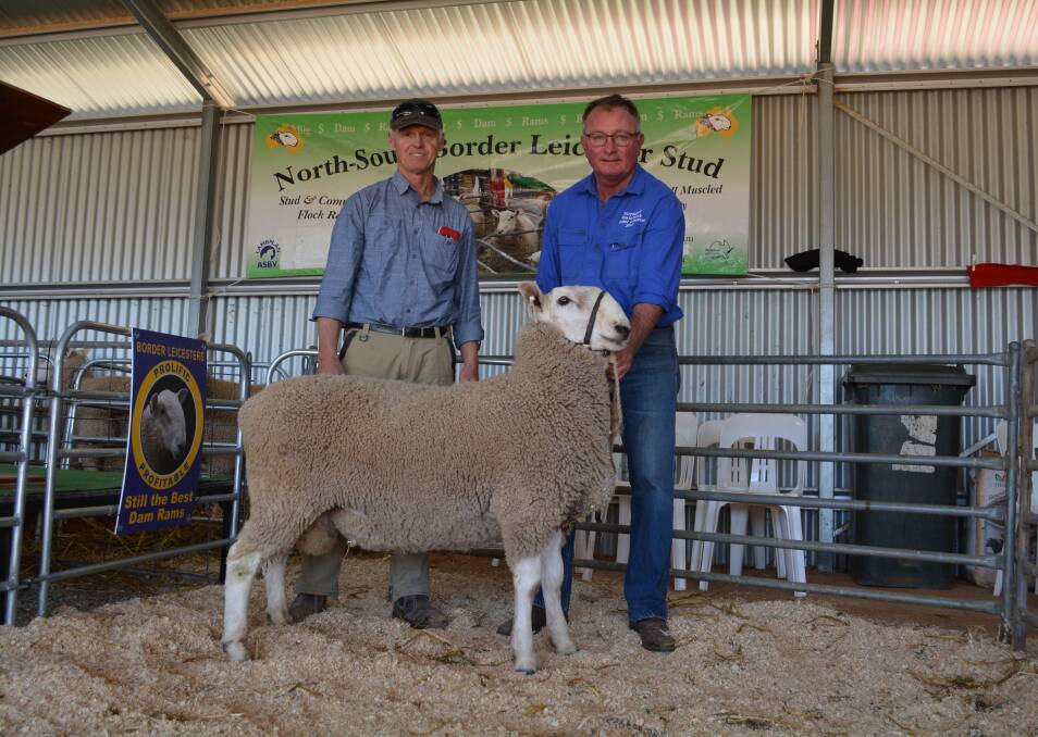 First time buyer Murray Walker, Cumnock Farms, Grenfell, with the $2000 top-priced ram held by North South Border Leicester co-principal Simon Makeham, Rothesay, Young. 