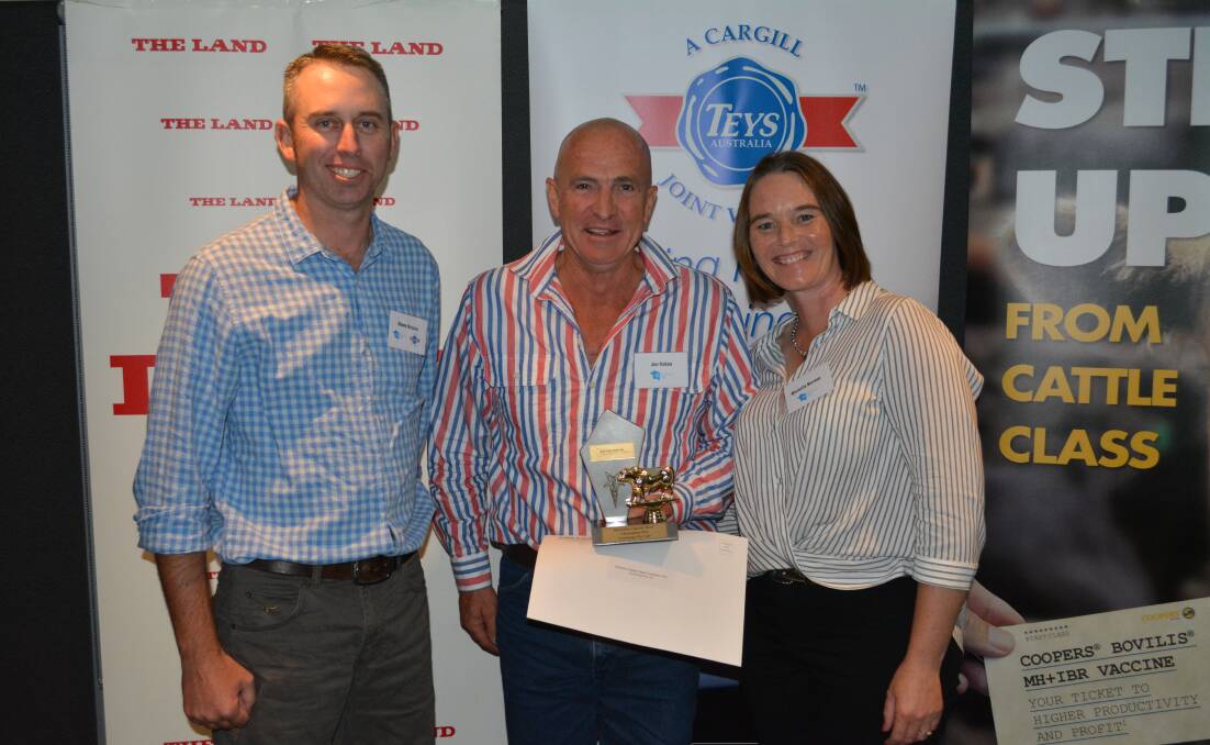 Teys Australia's Jindalee feedlot manager Shane Bullock, presented Coonong's manager Joe Gahan and Michelle Norman, Urana, with their trophy. 