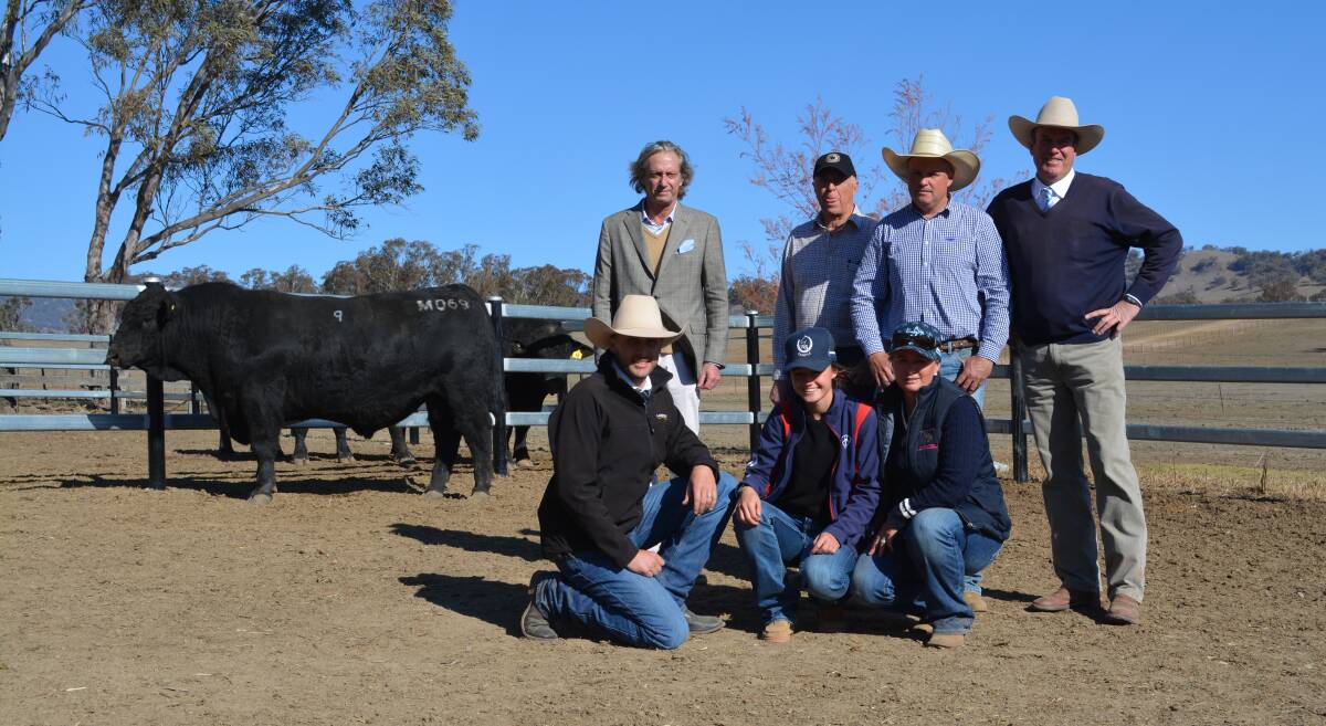 The $18,000 sale-topper with (front) Joel Fleming, Landmark Tamworth; Charlie and Trudy Chapman, Wombramurra stud, Nundle; and (back) Simon Miller, "Dunmore", Manilla; Peter Howarth and Andrew Chapman of the Wombramurra stud, Nundle, and guest auctioneer, Paul Dooley, Tamworth. 