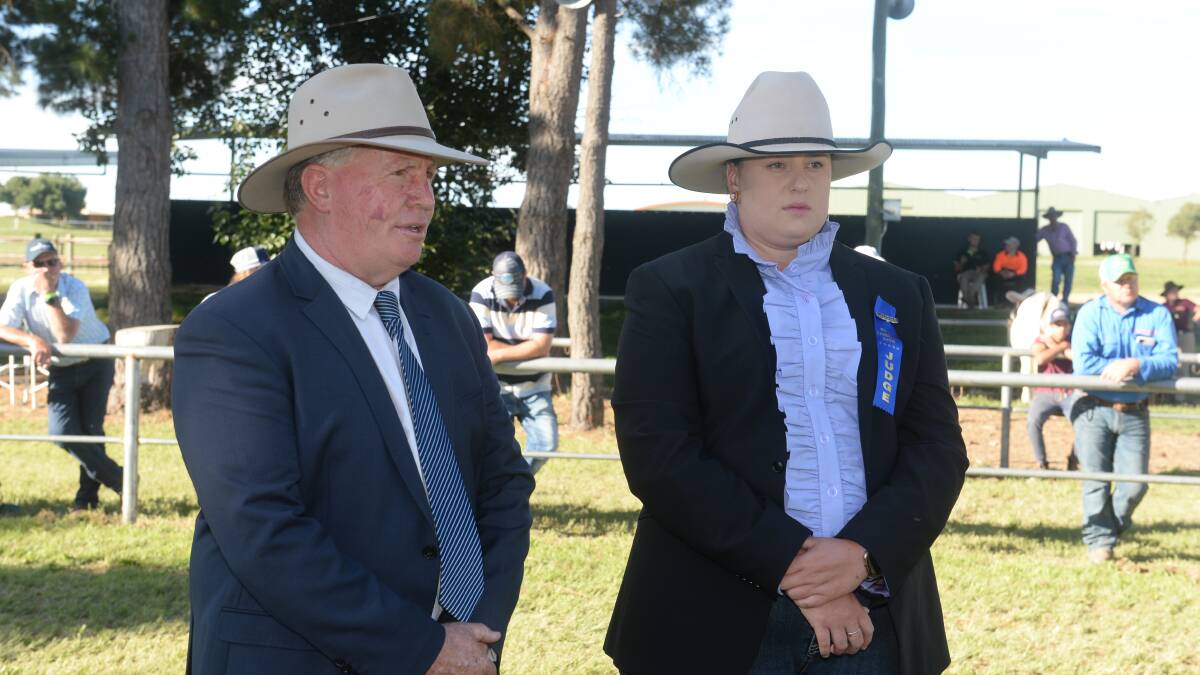 OFFICIAL DUTIES: Judge Graham Williams of Thunderbird Ag, Windsor, and his associate Emily Polsen of Grace Valley Livestock, Yass. Photo: Mark Griggs 