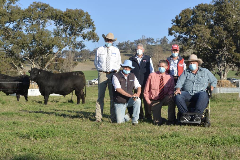 The $240,000 second top-priced bull with Paul Dooley, Tamworth, Millah Murrah's Ross Thompson, Bathurst, Bill Cornell of ABS Australia, Elders agent Andrew Bickford, Bathurst, Millah Murrah's Jane Thompson, Bathurst and Josh Clift of JT Angus, Scone. 