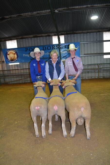 Bimbadeen Park's winning group of one ram and two ewes under 1.5 years, any wool, handled by students Emily Hoffmann, yr 9, and Linden Raaen (right), yr 10, and owner Sue McGoldrick, all of Coonabarabran. 
