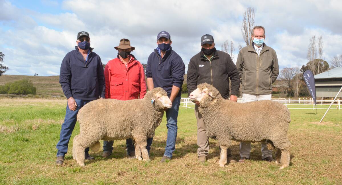 The top-priced Poll Merino and equal top-priced Dohne rams with Peter and Andrew (centre) Hughes of Gullendah stud, Baldry, Scott Thrift, Elders, Dubbo, Brad Wilson, Nutrien, Dubbo, and auctioneer Paul Dooley, Tamworth. 