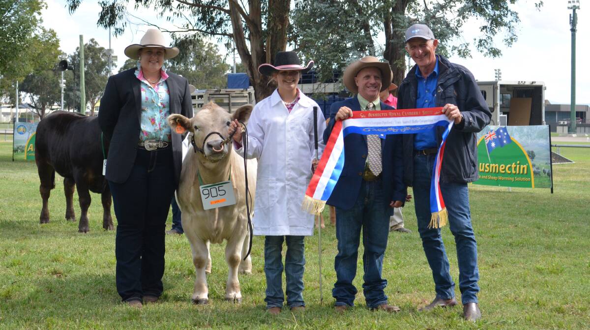 CHAMPION PUREBRED: Associate judge Emily Polsen, Grace Valley Livestock, Yass, with the champion purebred Square Meater steer held by St Johns College Dubbo student Jemima, year 7, with judge Steve Carter, Blackjack Shorthorns, Tumut, and breeder Wayne Petrie, Javid Square Meaters, Orange. 