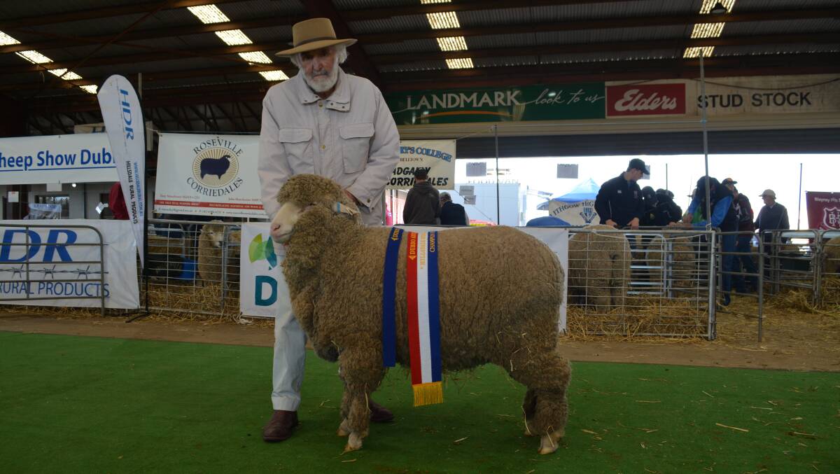 Winston McDonald with his champion fine wool ewe, Royalla A20650, who went on to be the reserve grand champion ewe of the show. 