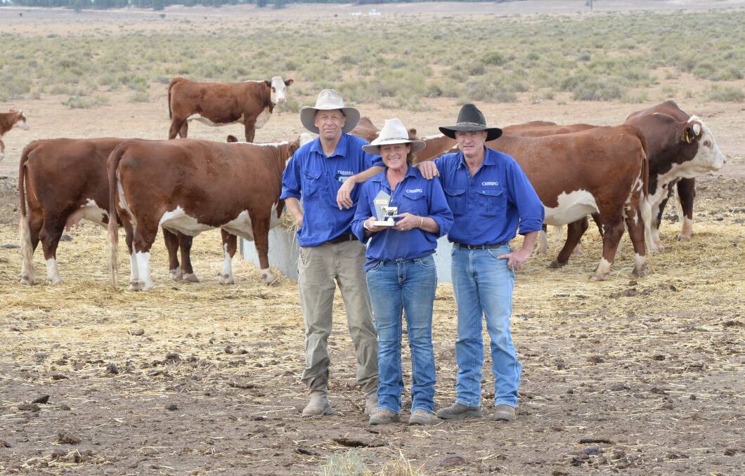 Tom and Sophie Holt from Tondara Herefords, Coonong Station, Urana, with manager Joe Gahan and their trophy for Riverine Classic Beef Champion pen. 