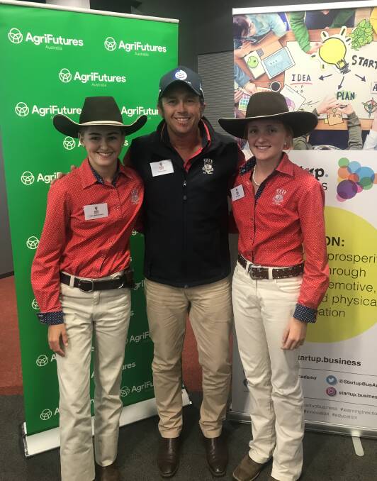 Kempsey High School students Freya Weismantel and Ellie Prior with agriculture teacher Gavin Saul (centre) at the University of Sydney on November 25 for the final pitch of their design - the Frellie Feeder. Photos supplied. 