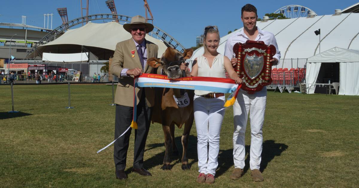 Gerry Anderson sashed the intermediate champion interbreed dairy female led by Stacey Leppert, Tennysonvale, Vic and pictured with Daniel Bacon, Brookbora Jerseys, Tennysonvale, Vic. 