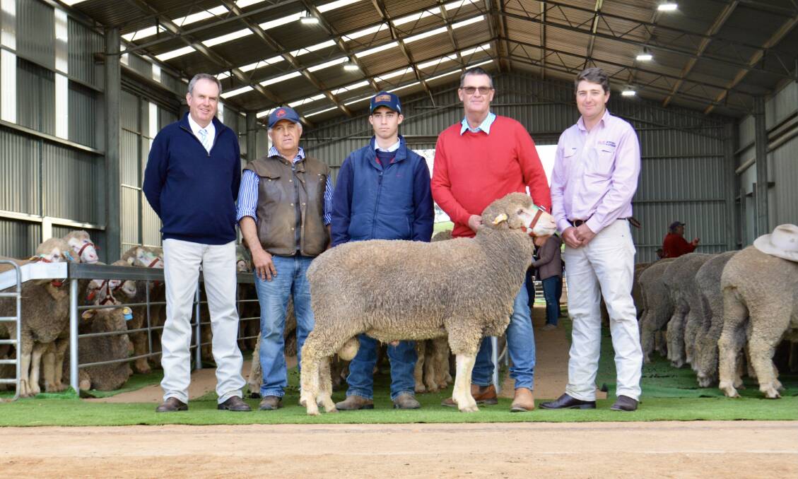 The $9000 second-top ram with auctioneers Paul Dooley, Tamworth and Nick Fogarty (right), B&L, Bathurst, with buyers Ado and Joe Scolari, Tomingley, and Nigel Kerin, Kerin Poll, Yeoval. 