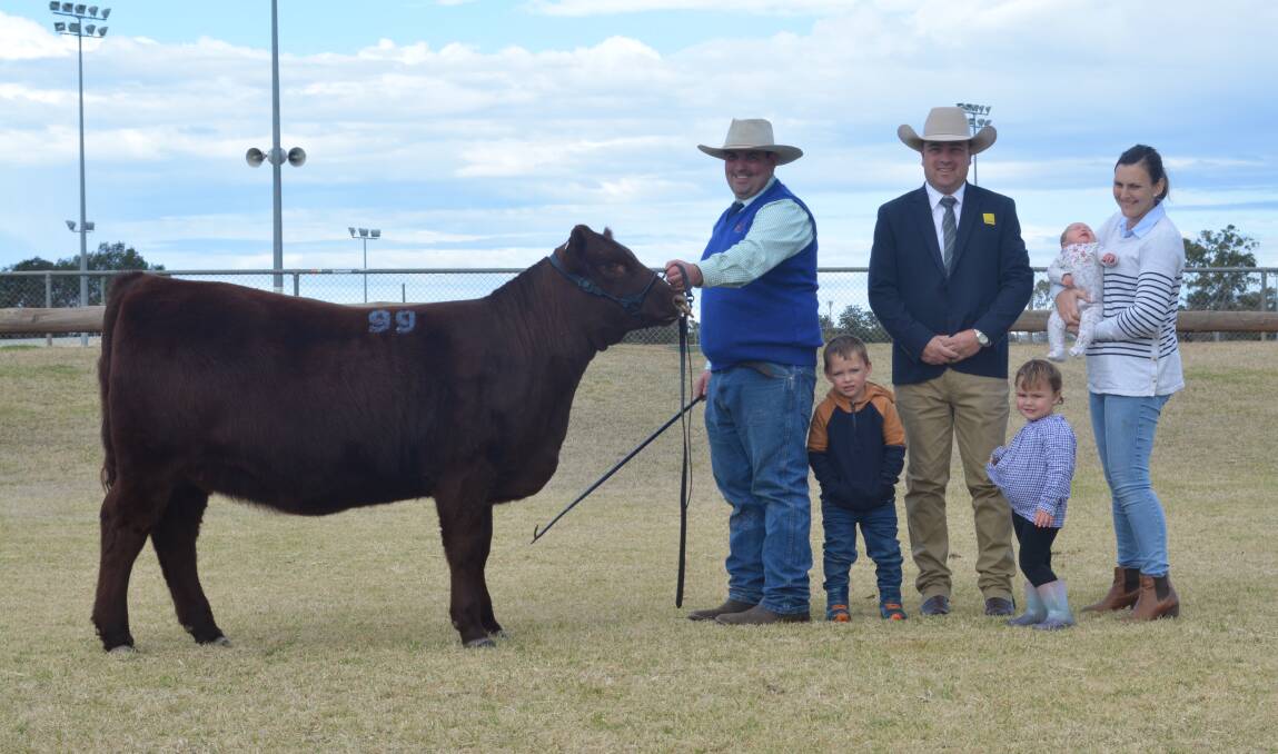 Sam and Jodie (right) Martin and their children of Southcote Shorthorns, Walcha with agent Ryan Morris, Ray White GTSM with the $8500 equal top-priced female sold to the Loane family of Dunroan Shorthorns, La Trobe, Tas. 