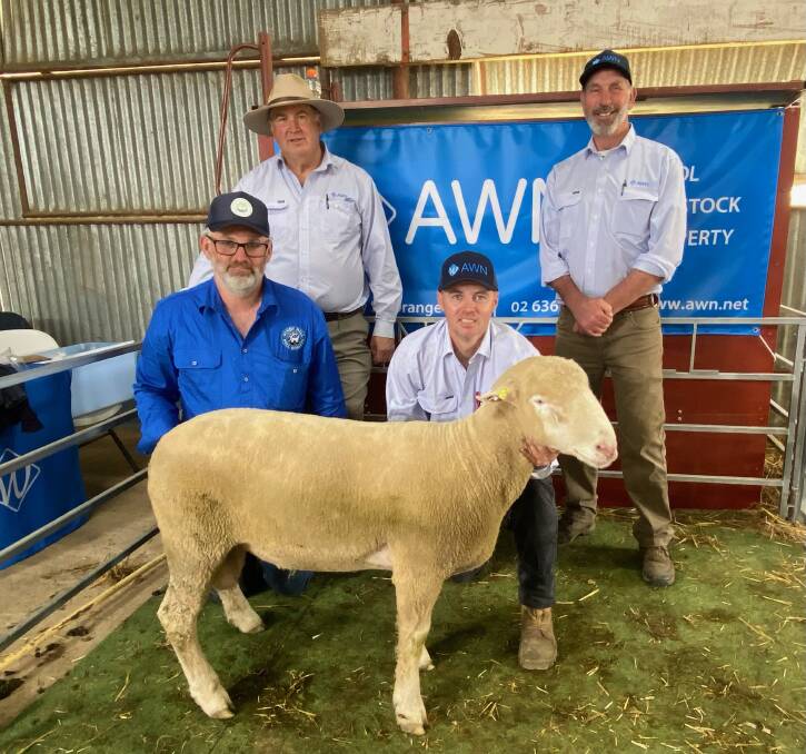 Windy Hill tag 58 sold for $2100 to Simon Oborn, Spring Hill, with AWN's Lindsay Fryer and Darren Connick, (front) Chris Roweth, Windy Hill, and Shaun Kirby, AWN. 