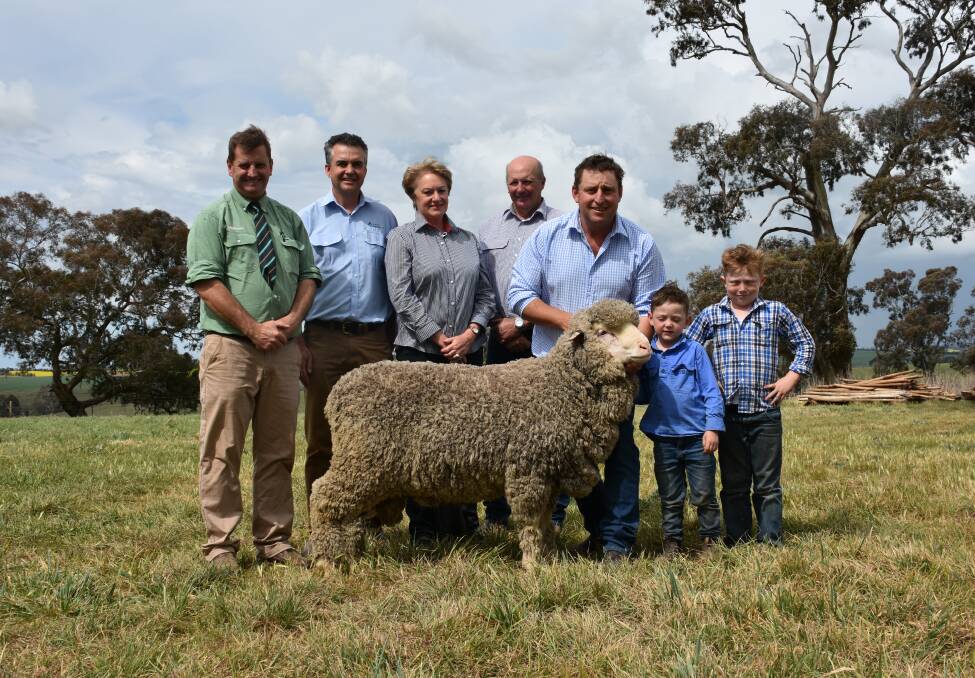 Landmark auctioneer Rick Power, Boorowa; Australian Wool Network NSW state manager Mark Hedley; purchasers Trish and Gary Hallam, Gunning; Grassy Creek owner Michael Corkhill and sons Hughie and Toby. 