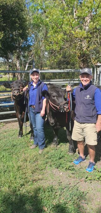 The Knowla-bred Angus steers at Pymble Ladies College with cattle coach Jill Burgess and farm manager Dave Goodwin. Photo: supplied 