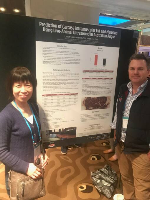 Angus Australia strategic operations manager, Christian Duff (right), presenting his poster on findings made by new ultrasound scan technologies for predicting IMF in live cattle. Mr Duff is pictured with Xuemei Han, a meat science technician from the University of New England.