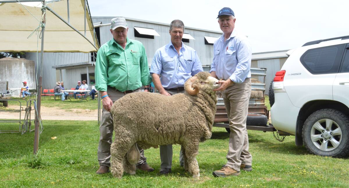 Nutrien stud stock auctioneer John Settree, Dubbo, return buyer Mont Waters, Ournie, and John Croake of selling agents AWN, with the $3250 top-priced ram. 