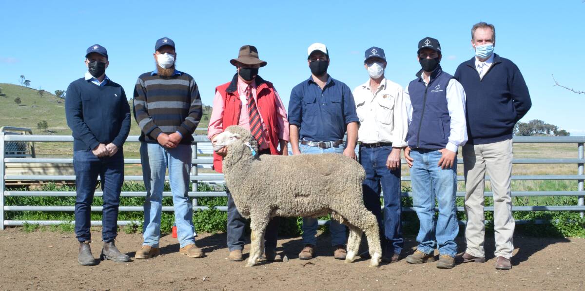Buyers Philip Dodds and Trent Morrissey of Oaklands Pastoral, Cumnock, with Elders stud stock agent Scott Thrift, Dubbo, new owners of the GullenGamble Poll Merino stud Max, Stewart and Hugh Edwards, Wellington, and auctioneer Paul Dooley, Tamworth. 