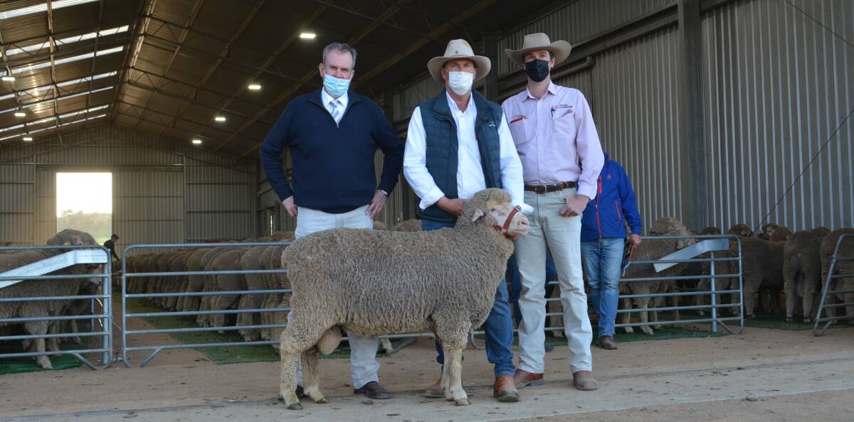 The $13,000 second-top ram with auctioneer Paul Dooley, Tamworth, Nigel Kerin, Kerin Poll, Yeoval and Bowyer and Livermore agent Todd Clements, Bathurst. 