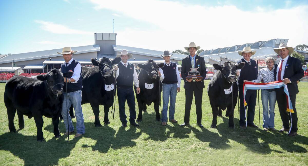 BREEDER'S GROUP: Handlers Ryan Morris, Phil McLauchlan, Lane Evans and Greg Fuller lead the Pine Creek Angus team from Woodstock to the top position. Presenting the trophy is RAS councillor Michael MacCue and holding the sash is Sharon Fuller, Pine Creek Angus, and judge Scott Hann, Truro Herefords, Bellata. 