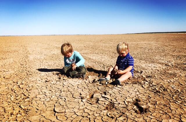 Finn and Archie Siemer on Yantara Lake, Coally Station north of Broken Hill, that went dry Christmas 2015. Many farms across NSW - not just the far west - are struggling with drought. Photo by Tennille Siemer.