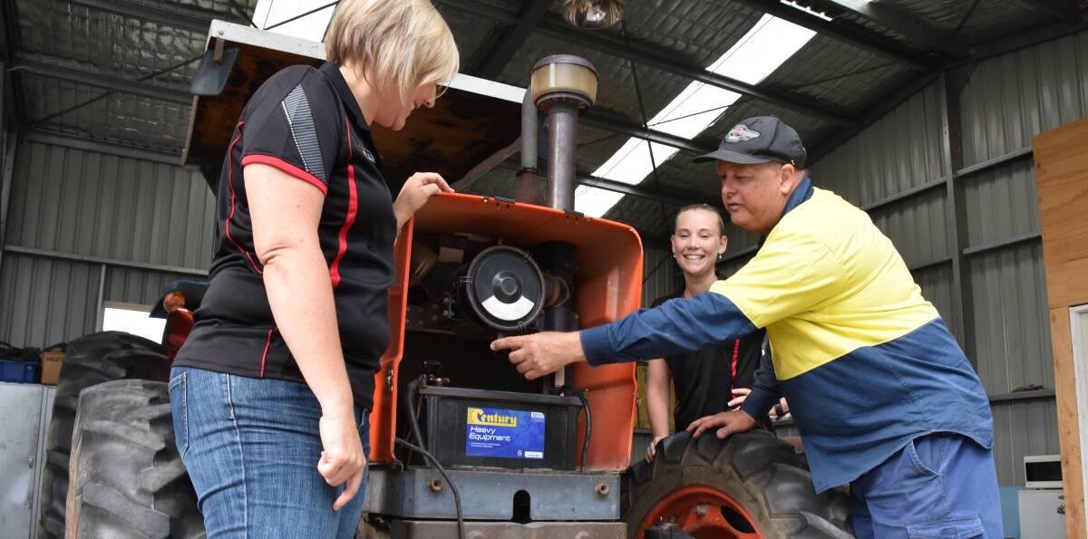 Cessnock's Mount View High School teachers Anna Wells and Sam Jarrett with Tocal College skills trainer Peter Olsen. Mr Olsen is part of a team delivering tractor training to teachers across the state. Photo by Alex Druce. 