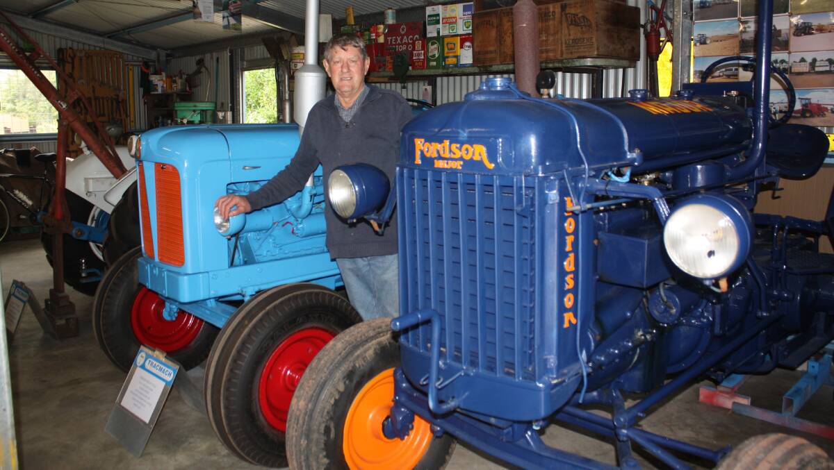 Former Dumbleyung farmer Robert Cook with his beloved 1948 Fordson E27N P6 (front) and 1954 Fordson Major tractors housed in his "American barn" on his Busselton property. 