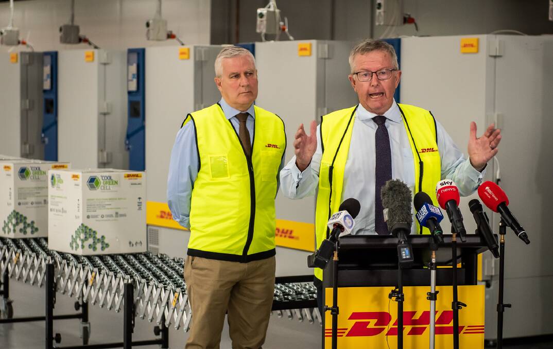 ROLLOUT: Regional Health Minister Mark Coulton and Deputy Prime Minister Michael McCormack at vaccine distribution centre.