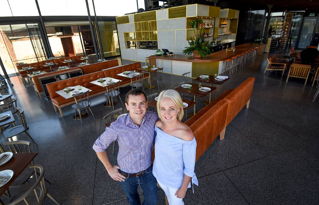 DINNER WITH A VIEW: Owners Simon and Sarah Haggarty in their new Glasshouse restaurant, which overlooks the 185-year-old station. Photo: Gareth Gardner 031116GGB11