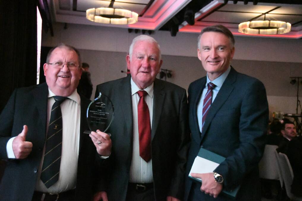 Forbes Jockey Club representatives Harvey Elliott and John Rennick, received the Outstanding Achievement Award from Darren Pearce of Tabcorp.