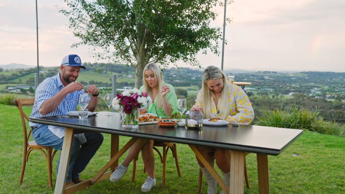 Farmer Brad enjoys a home-cooked meal with Christina and Natasha. Picture by Channel 7