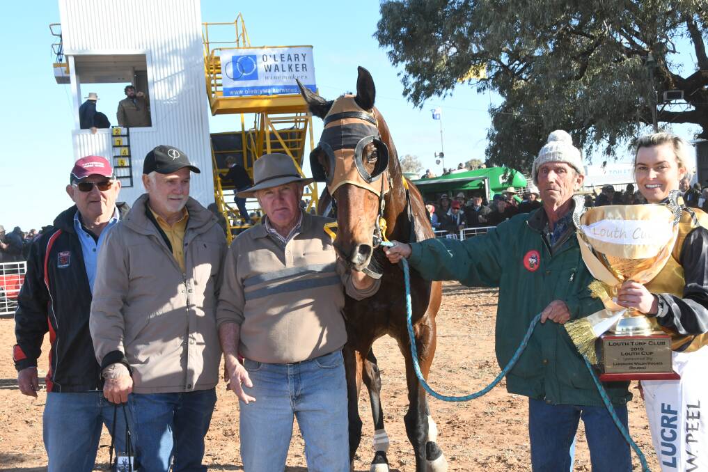 Scone part-owners Tom Pullman and Wayne Brown, Nyngan trainer Rodney Robb with Austin, strapper Paul Walsh and jockey Wendy Peel after their Louth Cup win.