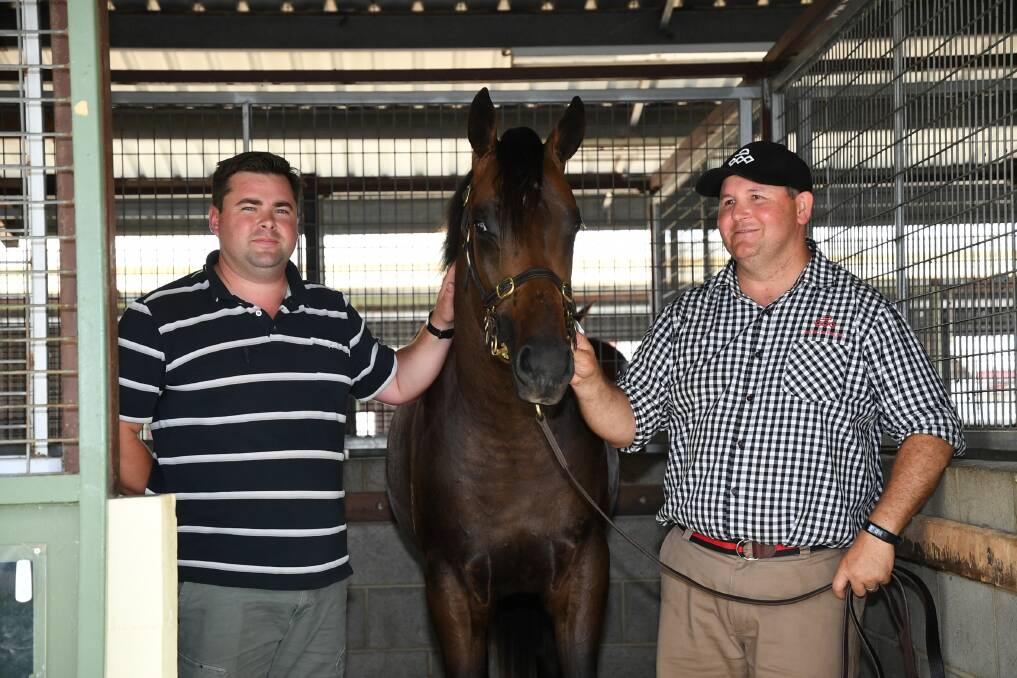 Warwick Farm trainer Richard Litt with the top price lot and the only colt by Deep Impact, with Arrowfield Stud horse handler Adam Shankley at the Magic Millions Gold Coast Yearling Sale last week. Photos Steve Hart