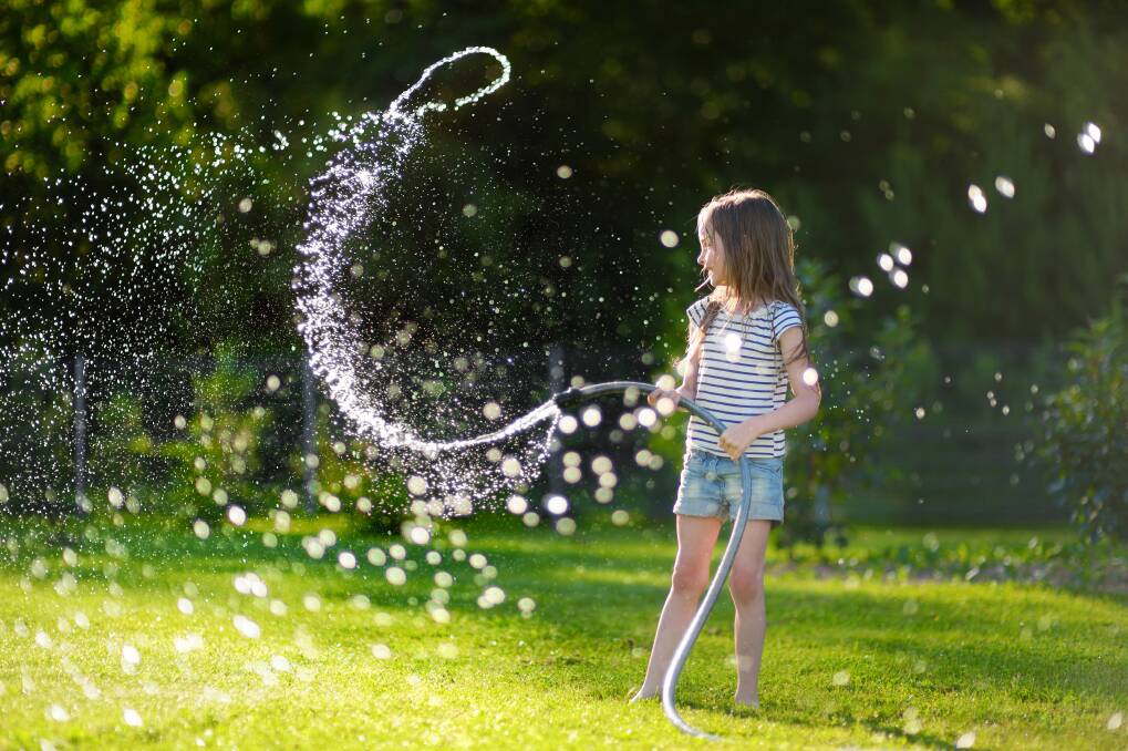 Stagnant water should be flushed through the hose before children play with it, and ensure water does not go up the nose. Photo by Shutterstock.