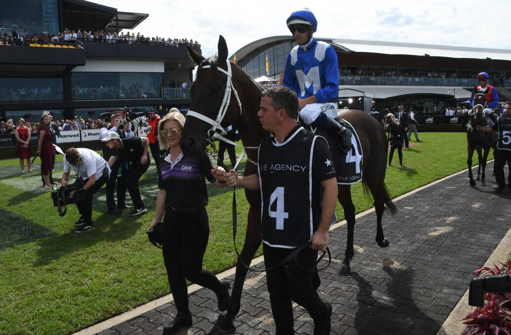 Winx prior to her 32nd successive win, with strappers Candice Persijn and Umut Odemislioglu at Rosehill Gardens on Saturday. Photo Virginia Harvey