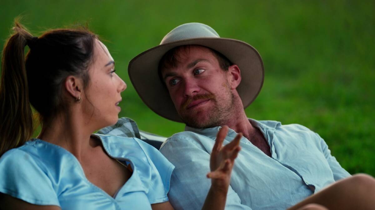 Emily can't take her eyes off Farmer David's luscious 'stache. Picture by Channel 7