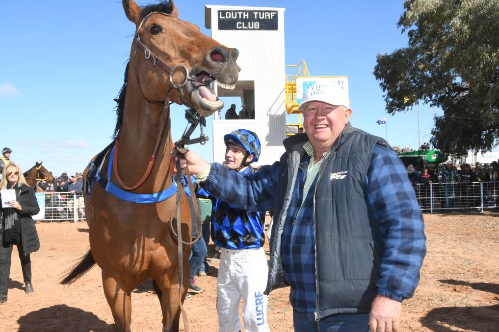 John Brown, representing the Peter Sinclair stable from Moree, was all smiles while Clayton Gallagher unsaddles I Am Dynamic after the recent win at Louth. Photos by Virginia Harvey