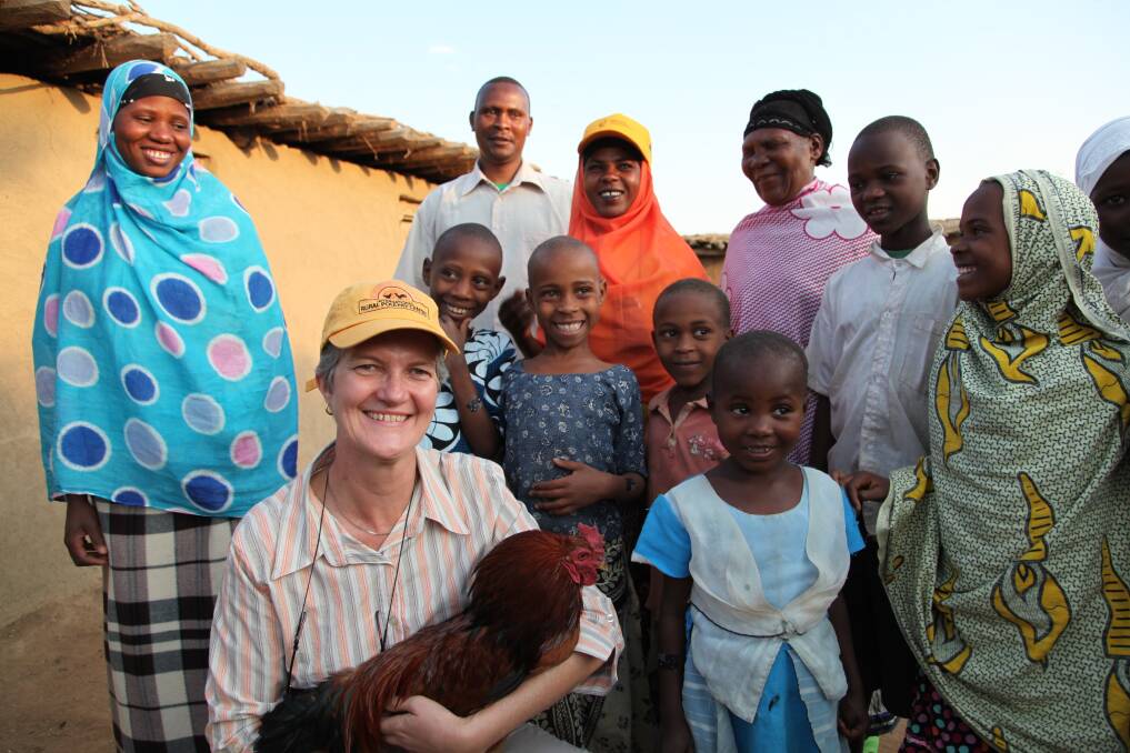 Dr Robyn Alders with local Tanzanian farmers and their families in 2012. Picture supplied