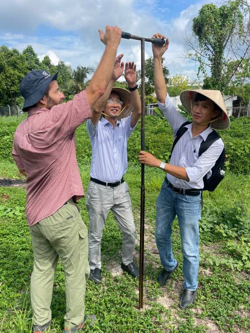 Dr Jason Condon, Dr Chau Minh Khoi, and Dr Dang Duy Minh take soil samples in the Mekong Delta. Picture supplied